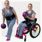 Woman wearing a ThermApparel RallyWrap standing and stilling in a wheelchair holding a bowling ball on a white background